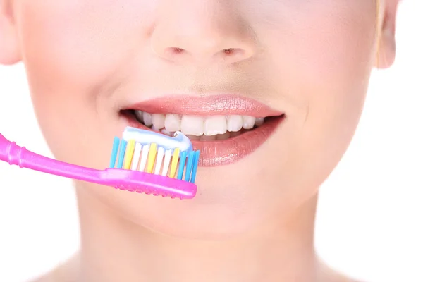 Beautiful young woman with toothbrush close-up — Stock Photo, Image