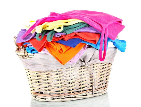 Fotos de Ropa en cesta de plástico naranja aislada en blanco - Imagen