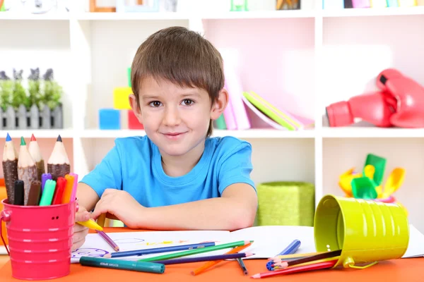 Cute little boy drawing in his album — Stock Photo, Image