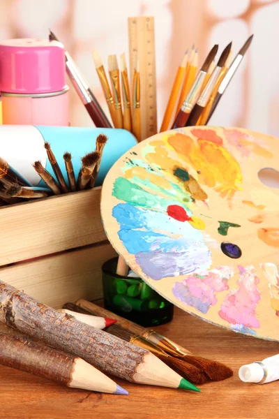 Artistic equipment: paint, brushes and art palette — Stock Photo, Image