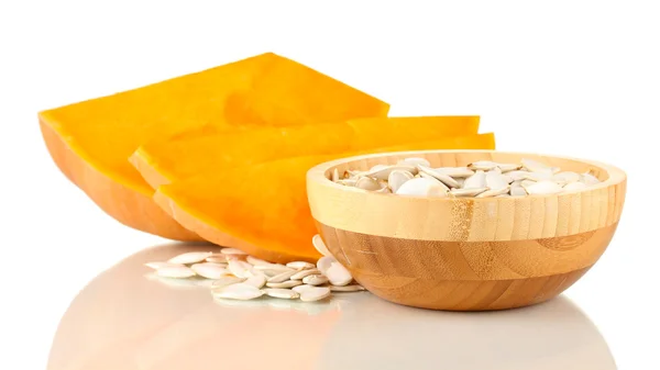 Pumpkin seeds in wooden bowl isolated on the white — Stock Photo, Image