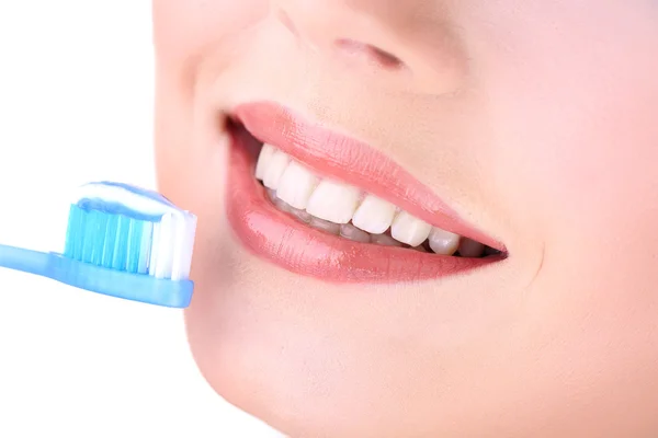 Beautiful young woman with toothbrush close-up — Stock Photo, Image