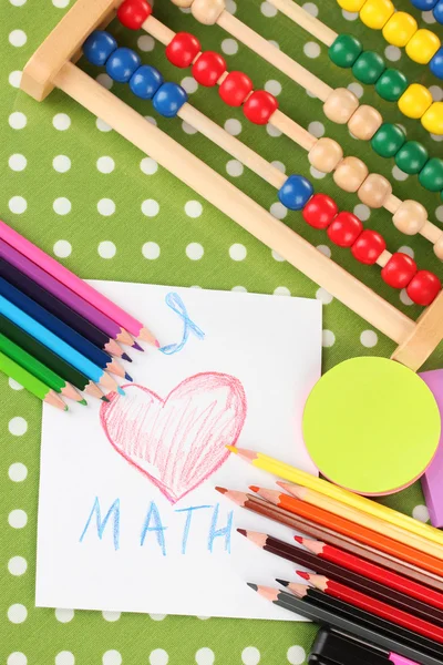 Toy abacus, notebook, pencils on bright background — Stock Photo, Image