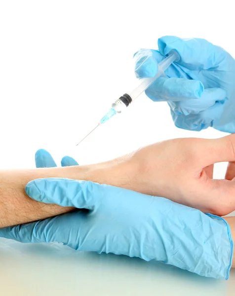 Läkare anläggning spruta med vaccin i patientens hand, isolerad på vit — Stockfoto