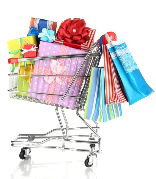 Christmas gifts and shopping in trolley isolated on white — Stock Photo, Image