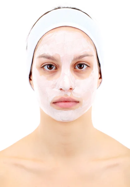 Jeune femme avec masque facial en argile, isolée sur blanc — Photo