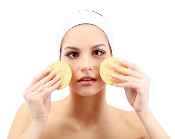 Young woman cleansing her face, isolated on white — Stock Photo, Image