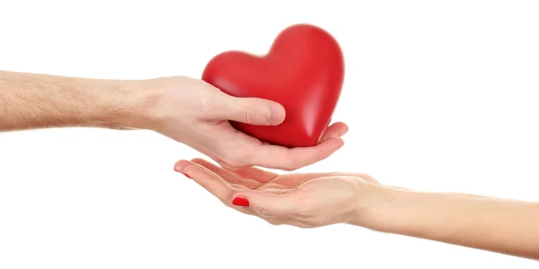 Kadın ve adam ellerini, üzerinde beyaz izole kırmızı kalp — Stok fotoğraf