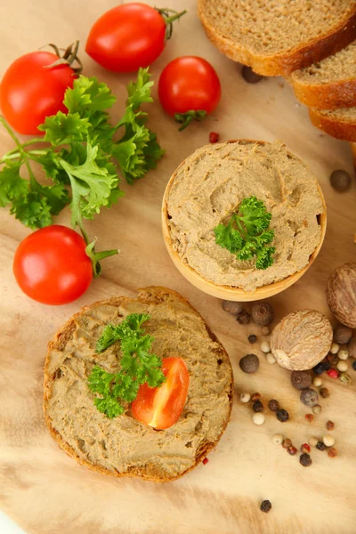 Fresh pate on wooden spoon, on wooden background — Stock Photo, Image