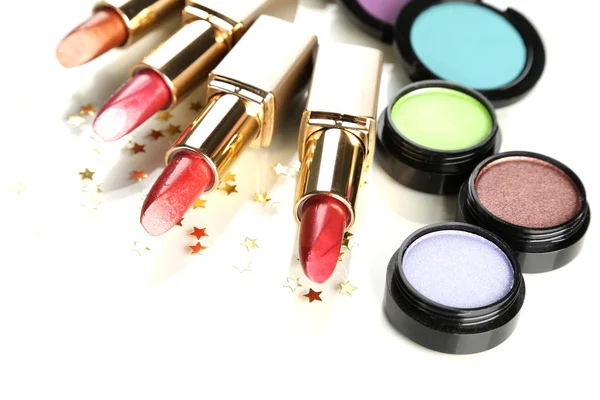 Beautiful lipsticks and eye shadows isolated on white — Stock Photo, Image