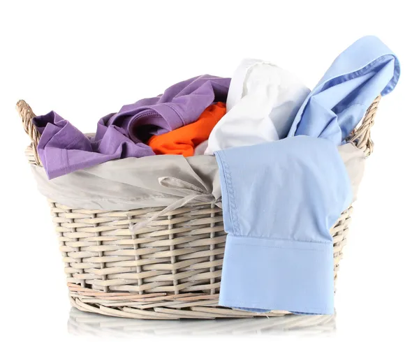 Bright clothes in laundry basket, isolated on white — Stock Photo, Image