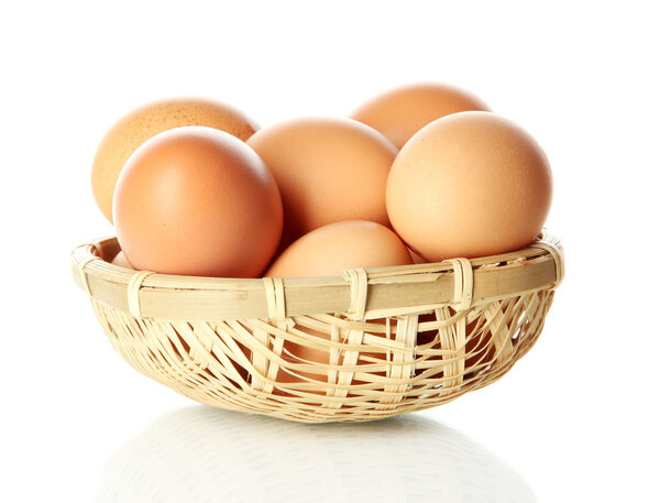 Many eggs in basket isolated on white