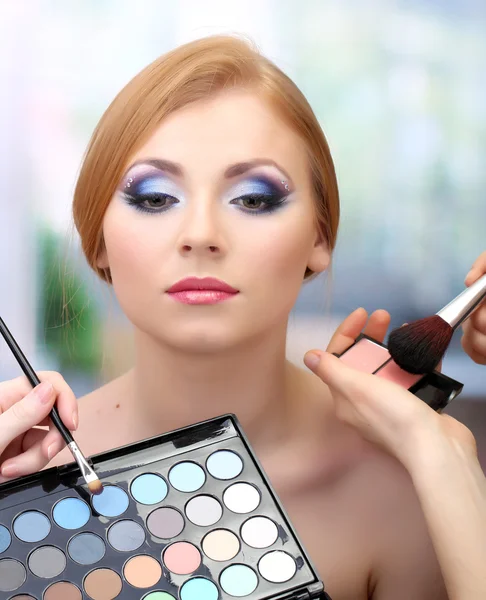 Portrait of beautiful young woman with making makeup in beauty salon — Stock Photo, Image