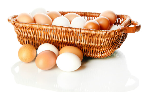 Many eggs in basket isolated on white