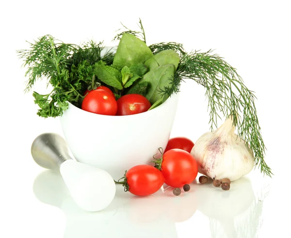 Composition of mortar, tomatoes and green herbals, isolated on white — Stock Photo, Image