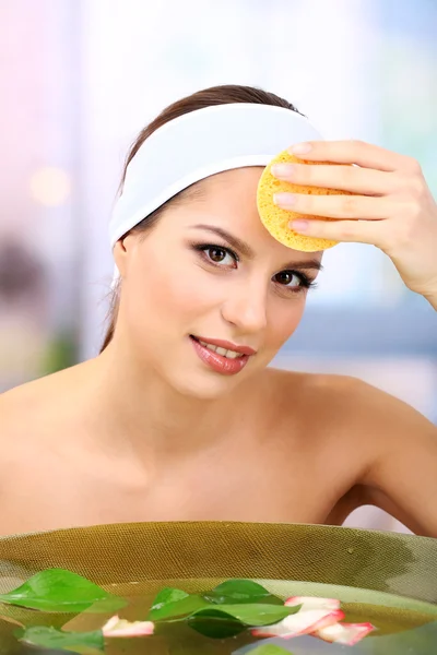 Young woman washing her face. Conceptual photo: make-up remover — Stock Photo, Image