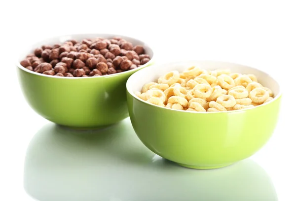 Delicioso y saludable cereal en cuencos aislados en blanco — Foto de Stock