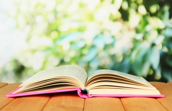 Opened book on bright background — Stock Photo, Image