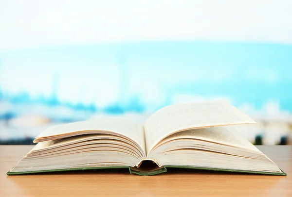 Opened book on bright background — Stock Photo, Image