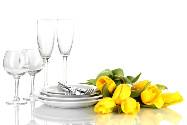 Yellow tulips and utensils for serving isolated on white — Stock Photo, Image