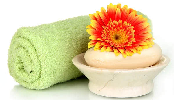 Rolled green towel, soap bar and beautiful flower isolated on white — Stock Photo, Image