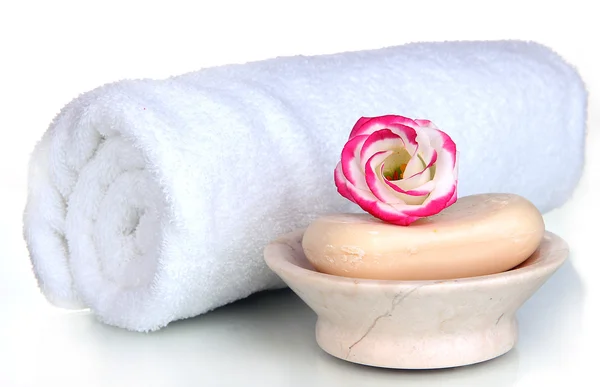 Rolled white towel, soap bar and beautiful flower isolated on white — Stock Photo, Image