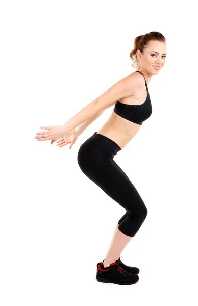 Jovem mulher fazendo exercícios de fitness isolado em branco — Fotografia de Stock