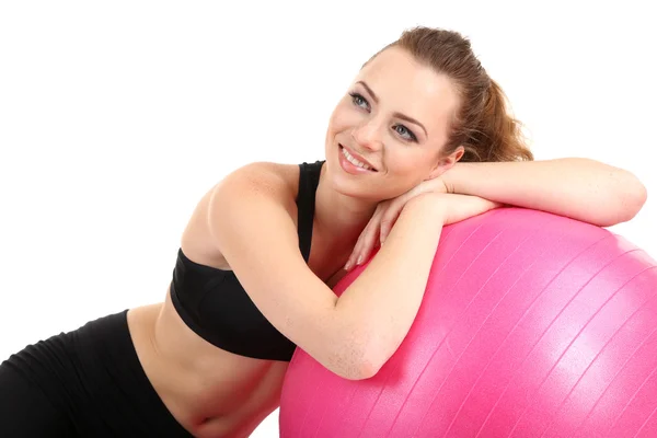 Jonge vrouw met gymnastiek bal geïsoleerd op wit — Stockfoto