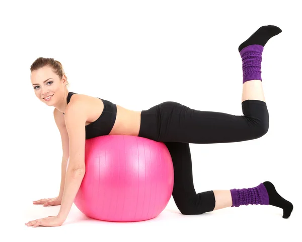 Jonge vrouw fitness oefeningen doen met gymnastiek bal geïsoleerd op wit — Stockfoto