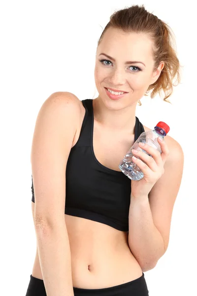 Mujer joven con agua después del entrenamiento aislada en blanco —  Fotos de Stock