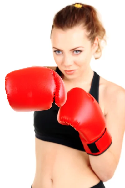 Jovem mulher bonita com luvas de boxe no treino isolado em branco — Fotografia de Stock