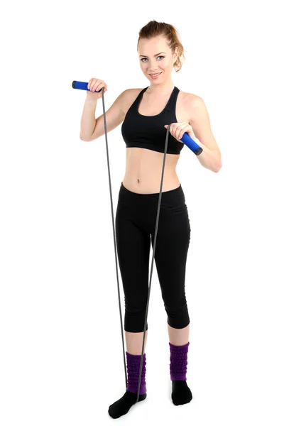 Young woman with skipping rope isolated on white — Stock Photo, Image