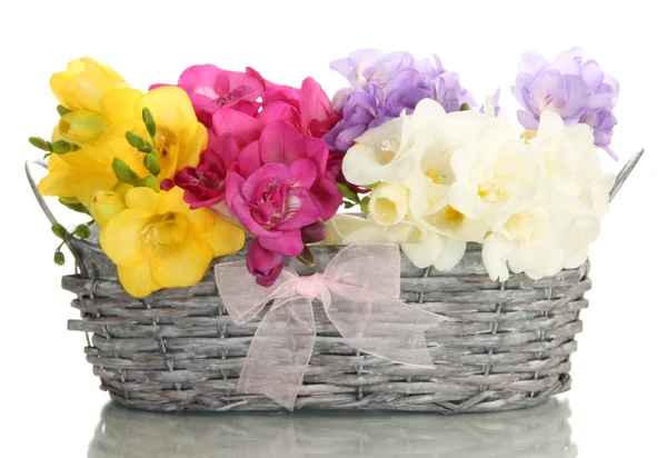 Beautiful bouquet of freesias in basket, isolated on white — Stock Photo, Image