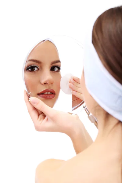 Young woman cleansing her face, isolated on white — Stock Photo, Image