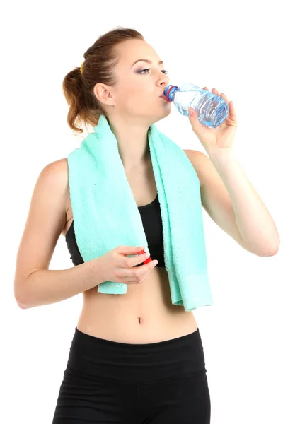 Young woman with water after workout isolated on white — Stock Photo, Image