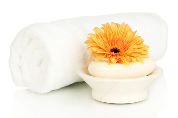 Rolled white towel, soap bar and beautiful flower isolated on white — Stock Photo, Image