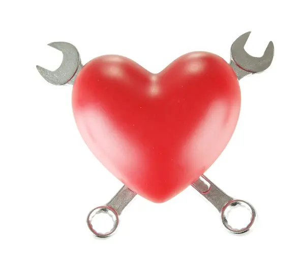 Heart and tools. Concept: Renovation of heart. Isolated on white — Stock Photo, Image