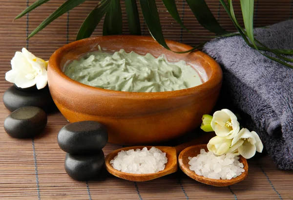 Composition with cosmetic clay for spa treatments, on bamboo background — Stock Photo, Image