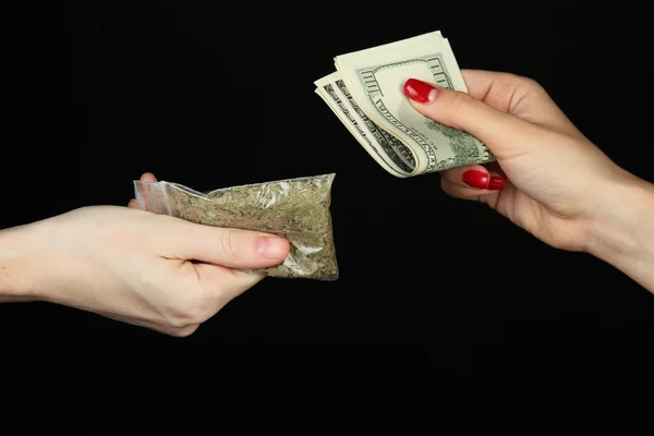 Dealer sells drug bag, isolated on black — Stock Photo, Image