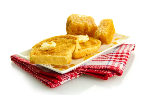 Pan blanco tostado con miel en plato, aislado sobre blanco —  Fotos de Stock