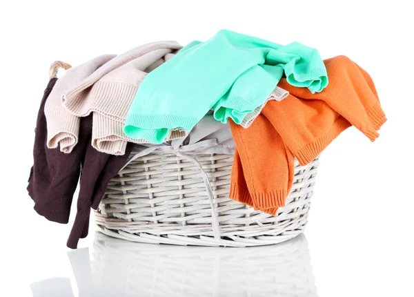 Clothes in wooden basket isolated on white — Stock Photo, Image