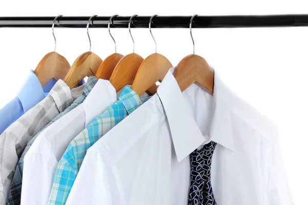 Shirts with ties on wooden hangers isolated on white — Stock Photo, Image