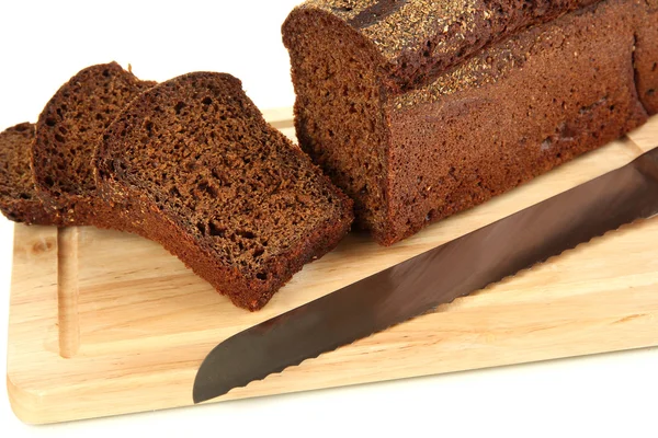 Sliced black bread and knife on wooden board close up — Stock Photo, Image