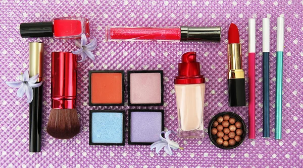 Decorative cosmetics on purple background — Stock Photo, Image