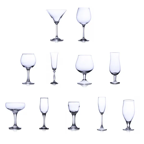 Collection of empty glasses isolated on white background — Stock Photo, Image