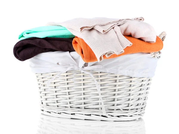 Clothes in wooden basket isolated on white — Stock Photo, Image