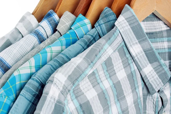 Shirts with ties on wooden hangers close-up — Stock Photo, Image