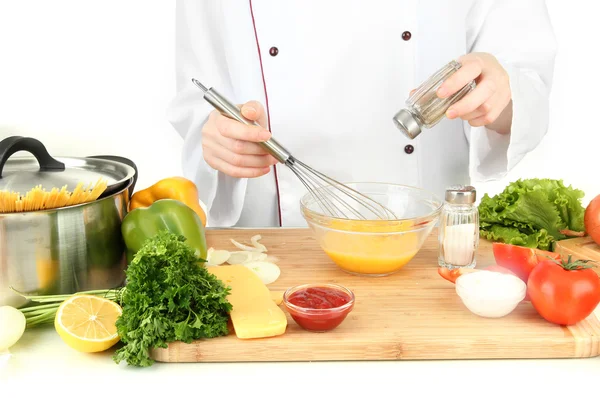 Female hands blending eggs in glass bowl — Stock Photo, Image