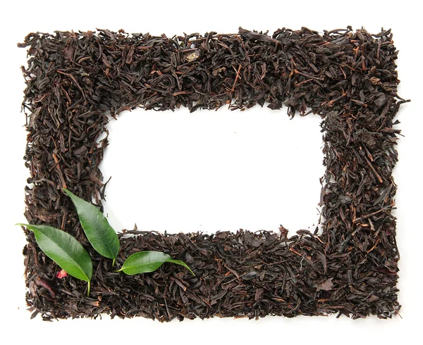 Frame of dry black tea with green leaves, isolated on white — Stock Photo, Image