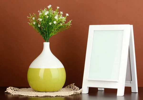 White photo frame for home decoration on brown background — Stock Photo, Image